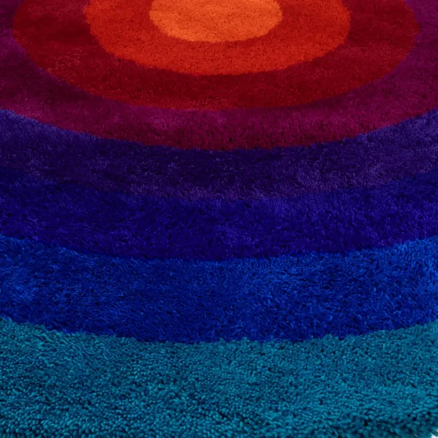 Stunning Amini Romantica-Circle rug hand-tufted in New Zealand wool with a gradient of blues to orange-red and carved finish