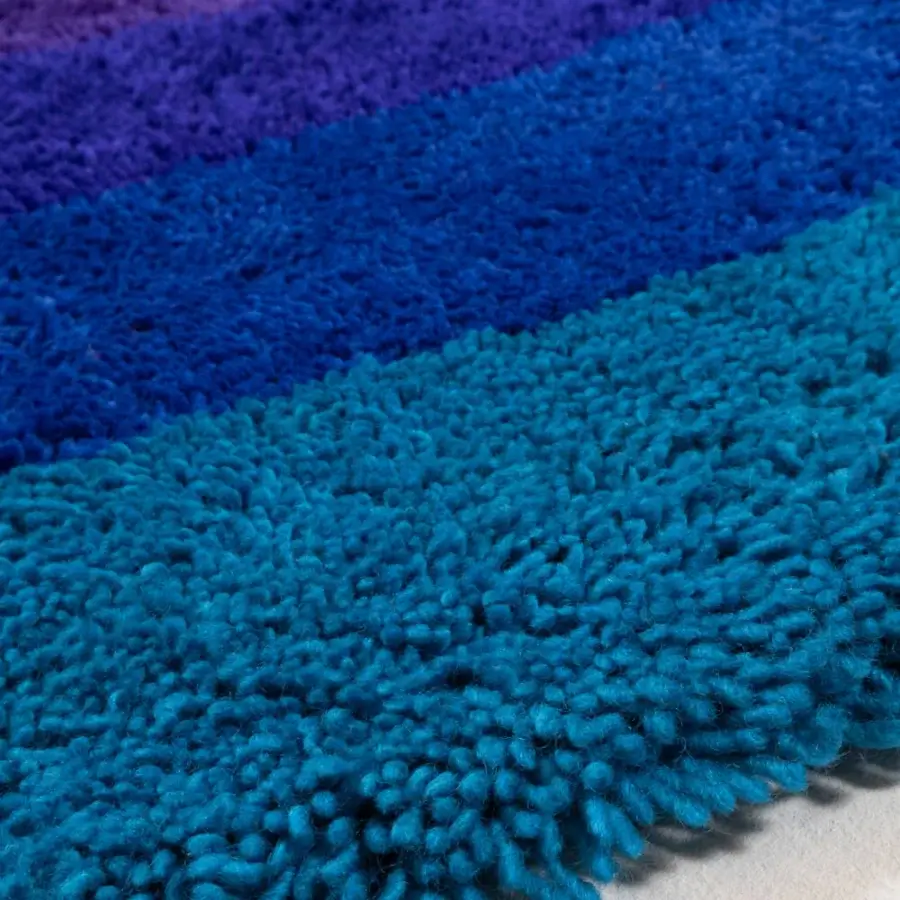 Exceptional Amini Romantica-Circle rug hand-tufted in New Zealand wool with vibrant blue and purple horizontal stripes and a clipped finish