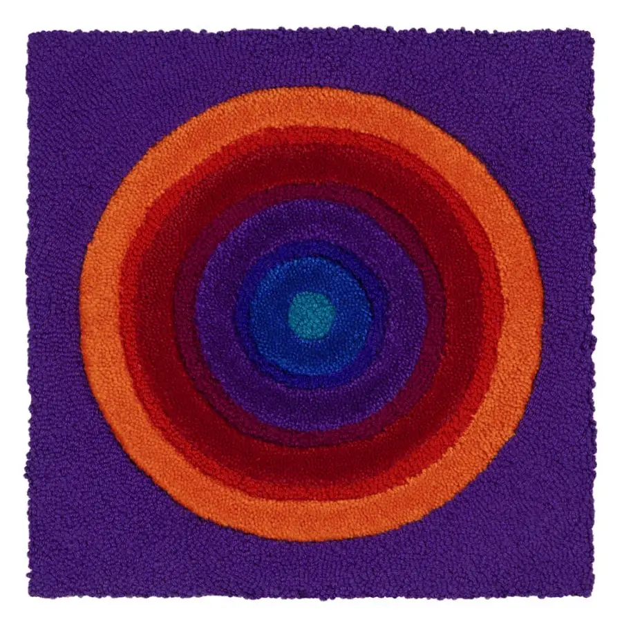 Distinguished Amini Domino rug showcasing concentric circles in blue, purple, red, and orange New Zealand wool with hand-washed carved finish