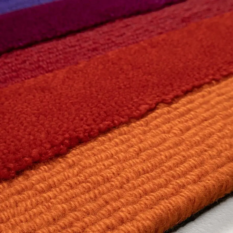 Lavish Amini Domino rug hand-tufted in New Zealand wool with a gradient of warm tones and textured finish