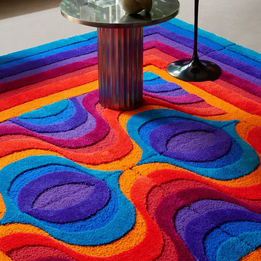 Exceptional Amini Domino rug crafted from New Zealand wool in red, orange, purple, and blue with hand-washed carved texture