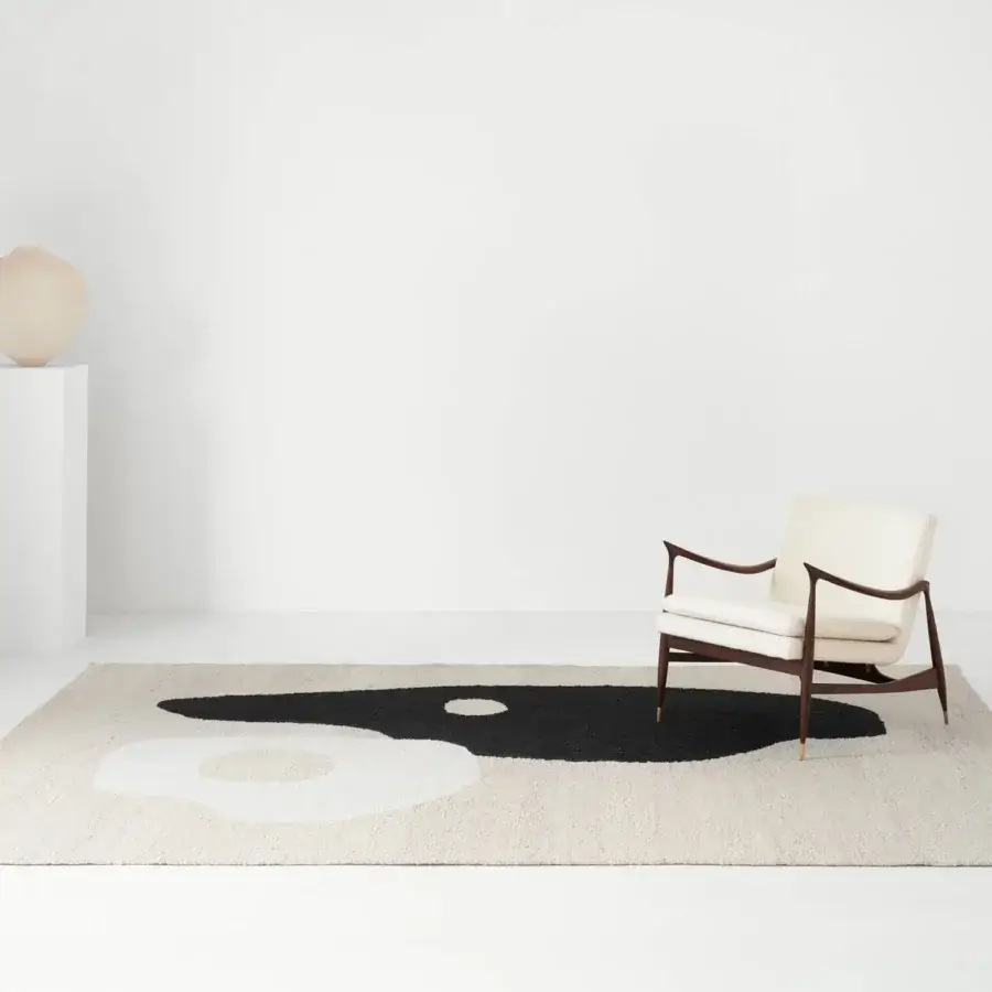 Exceptional Amini Jean rug crafted from soft wool and raw jute with dark grey and ivory abstract shapes and hand-clipped finish