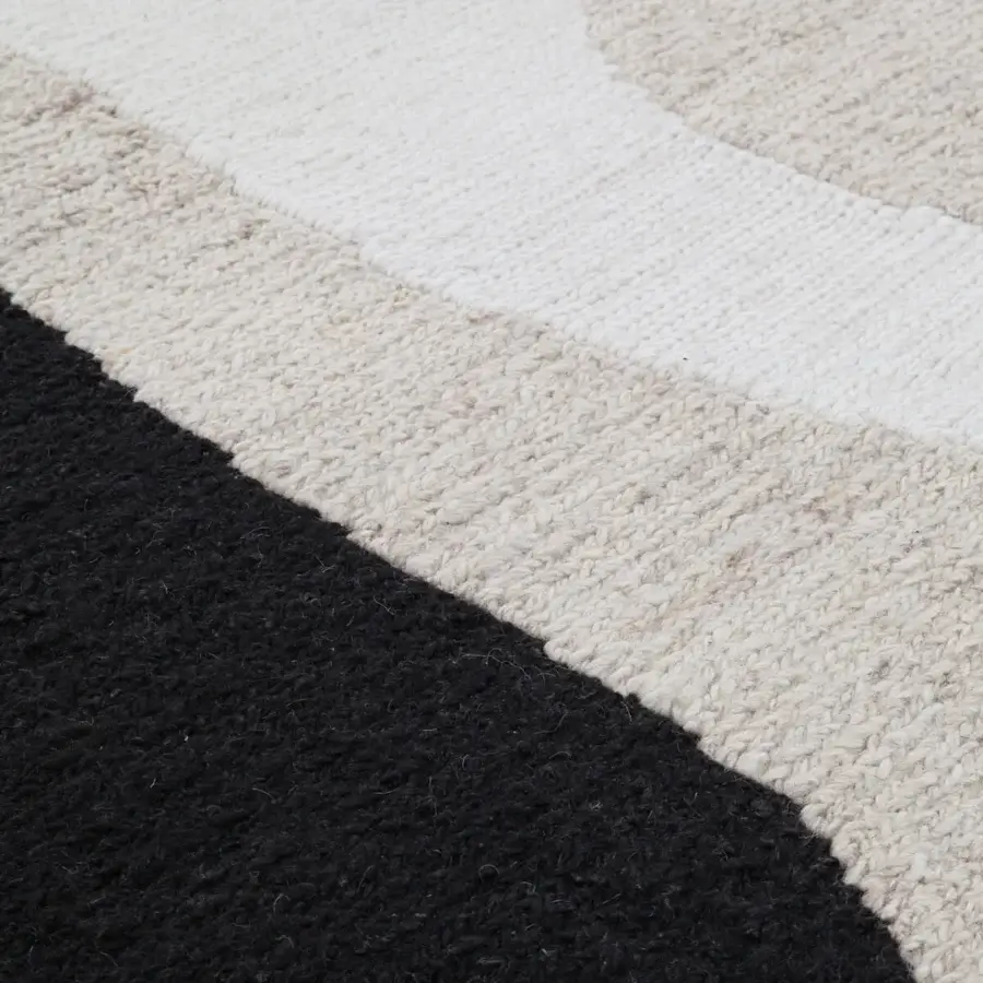 Distinguished Amini Jean rug with organically shaped patterns woven in ivory, dark grey, and brown wool using the Soumak technique