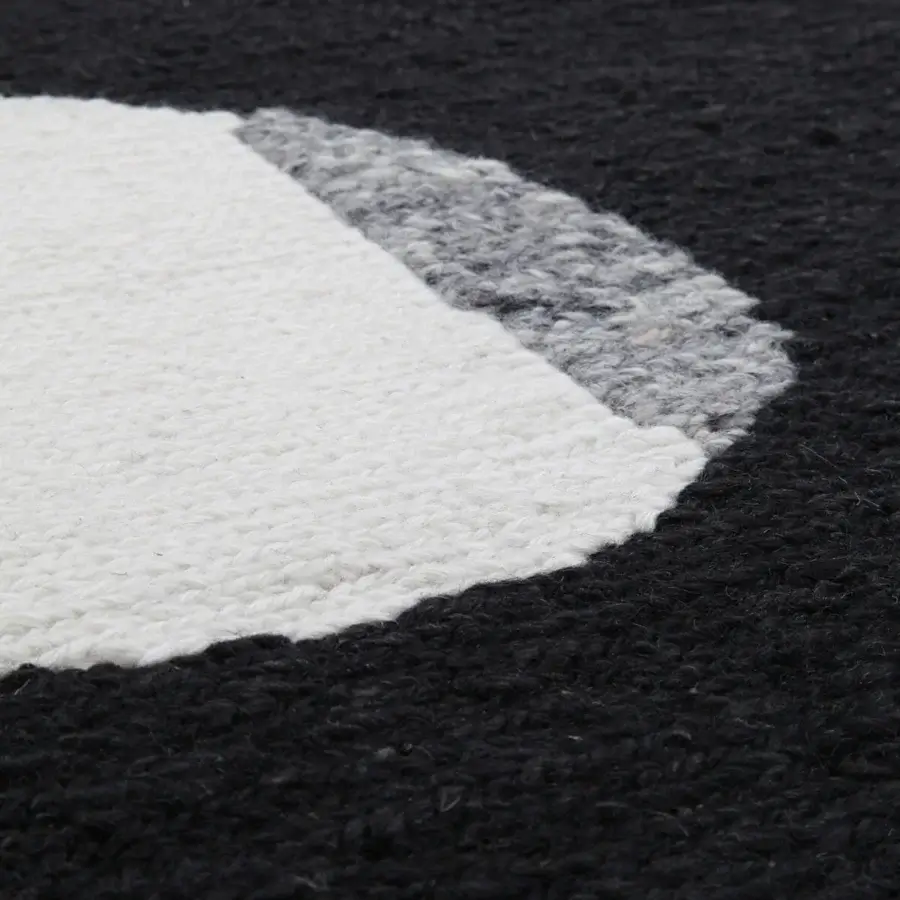 Exceptional Amini Jean rug displaying an abstract design hand-clipped and woven with ivory, dark grey, and brown wool pile