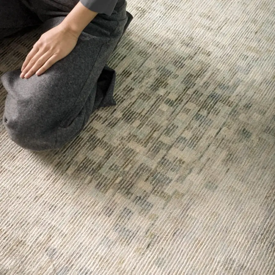 Distinguished Amini Lake rug crafted from pure silk with muted gray, beige, green, and blue hues and hand-washed carved finish