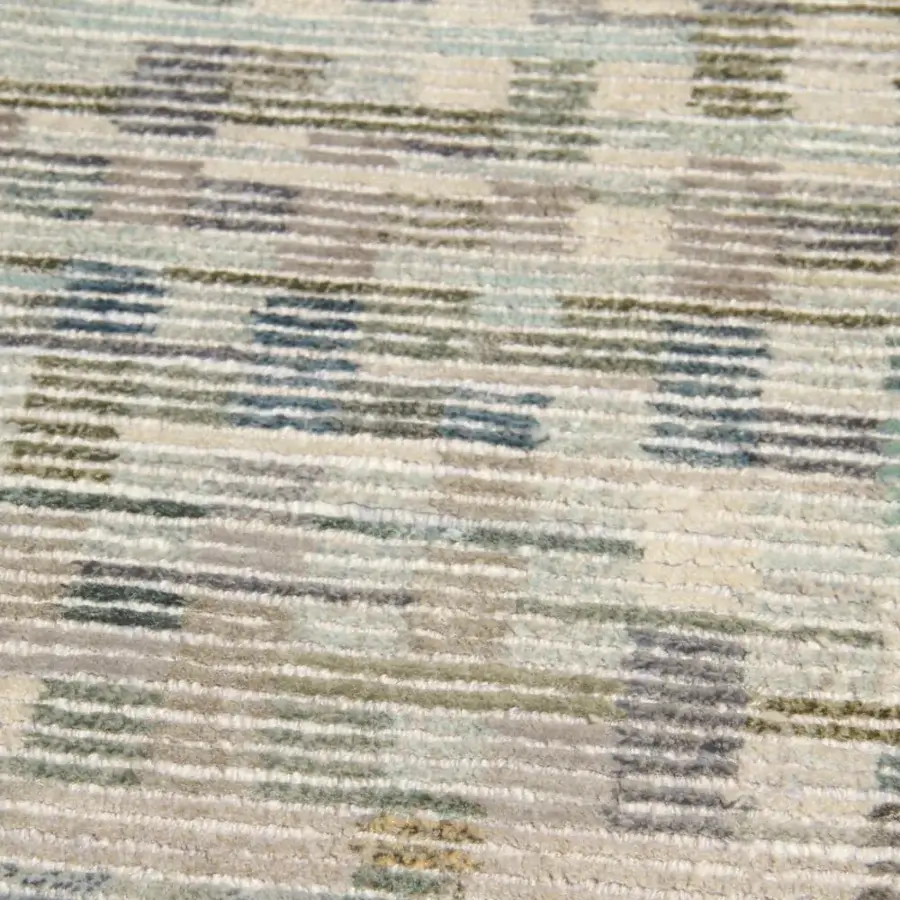Superior Amini Lake rug hand-knotted in Nepal with striated layers of silk exhibiting muted blue, gray, and olive green hues with meticulous carving