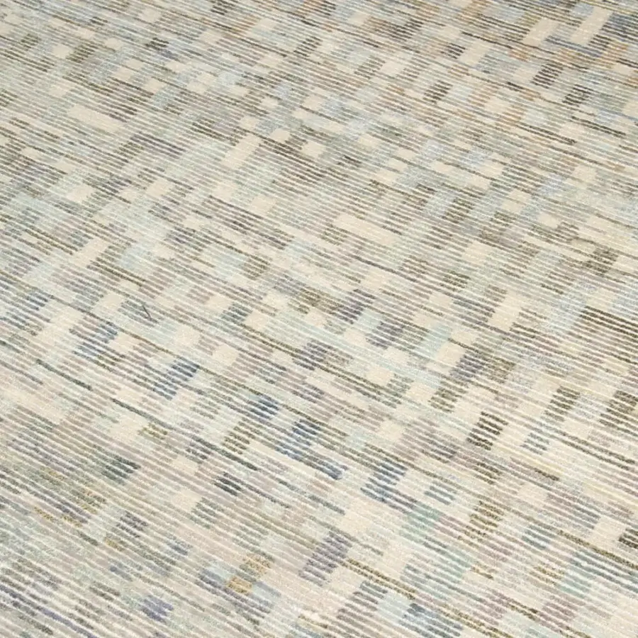 Exceptional Amini Lake rug hand-knotted with a captivating abstract design in muted blue, gray, and beige pure silk with meticulous carving