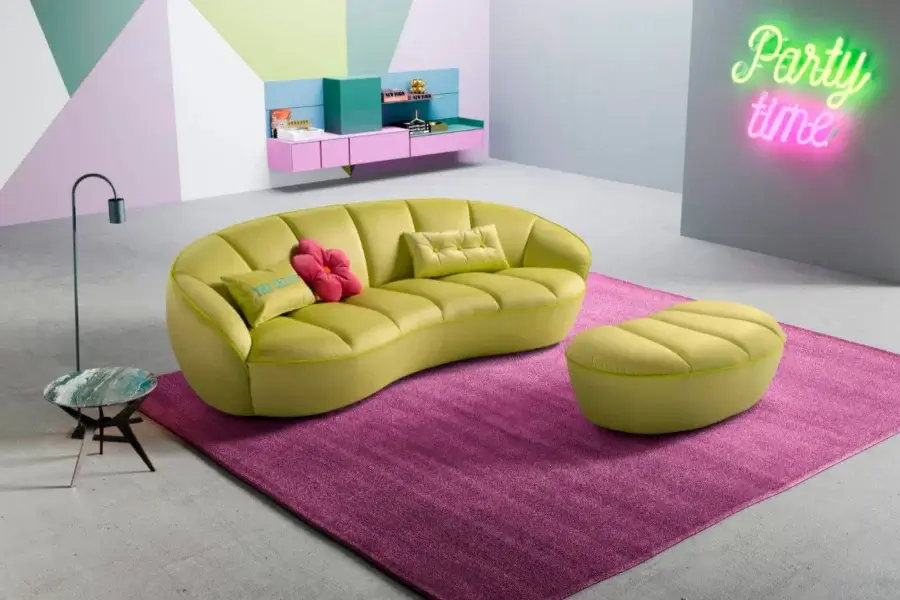 Distinguished Egoitaliano Shai sofa with curved form upholstered in matte bi-elastic fabric and creamy white cushions