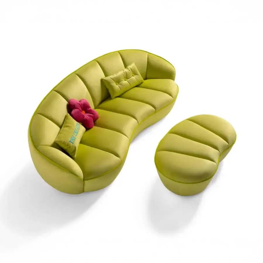 Elegant Egoitaliano Shai sofa with a curved silhouette upholstered in yellowish-green bi-elastic fabric and low ABS feet