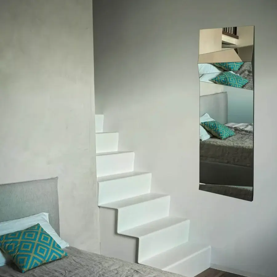 Distinguished Bontempi Illusion mirror crafted in Italy with angular mirrored segments and a neutral reflective glass finish