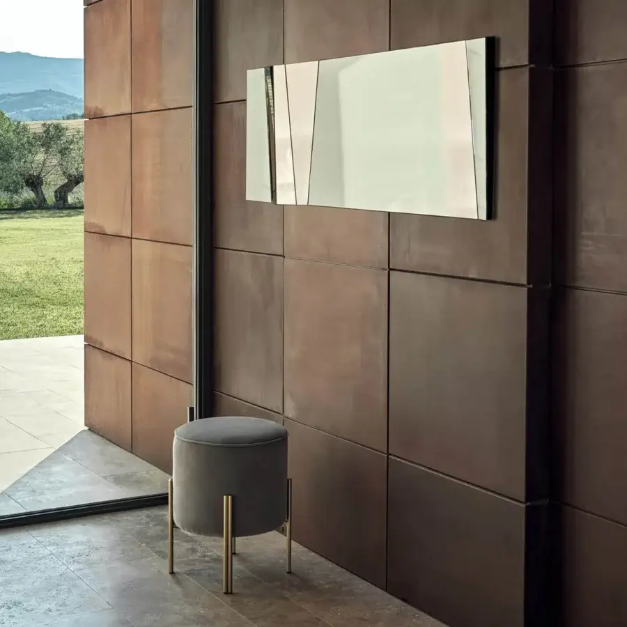 Exceptional Bontempi Illusion mirror crafted in Italy with a glass surface and matte metal frame exhibiting an asymmetrical design