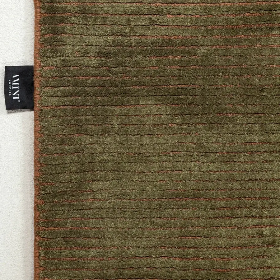 Distinguished Amini Twilight rug hand loomed in muted olive green Tibetan wool and natural silk with a pile loop and cut finish