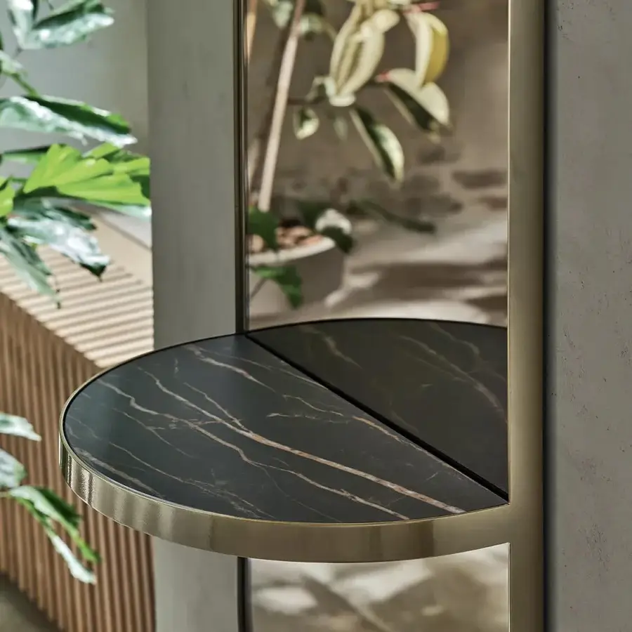 Exceptional Bontempi Pill Mirror with curved form and dark marbled stone shelf in polished metal finish