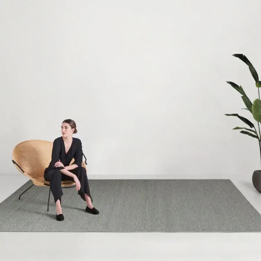 Distinguished Amini Plain rug crafted with polypropylene, viscose and polyester in a muted grey-green with a matte finish