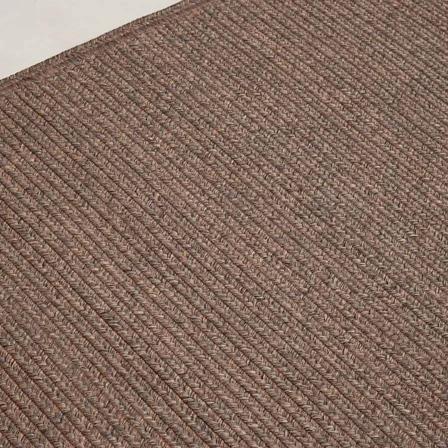 Distinguished Amini Plain rug hand-braided in India with polypropylene, viscose, and polyester, finished with hand clipping