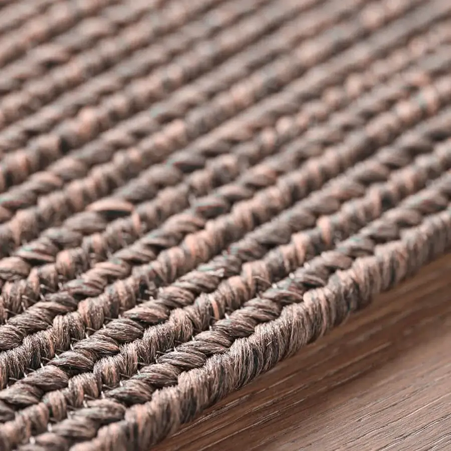 Lavish Amini Plain rug hand-braided in India with terra-toned polypropylene, viscose, and polyester weave with a clipped finish