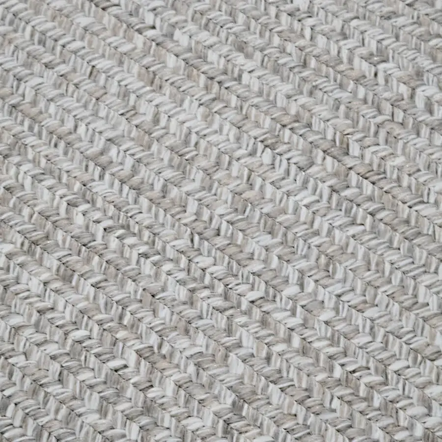 Exceptional Amini Plain rug hand-braided with beige polypropylene, viscose, and polyester, showcasing a heathered texture and clipped finish