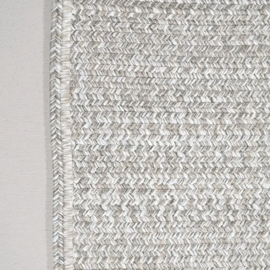 Exceptional Amini Plain rug hand-braided in India with terra-toned polypropylene, viscose, and polyester with a matte finish