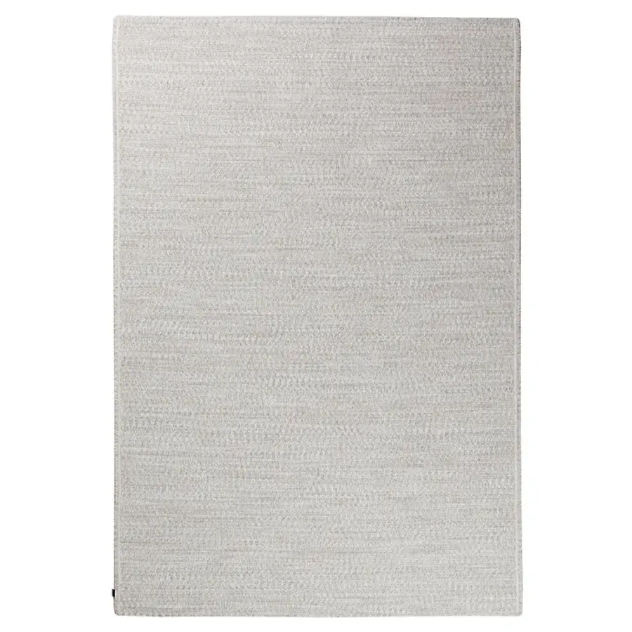 Superior Amini Plain rug crafted with polypropylene, viscose, and polyester in a light neutral tone with hand clipping