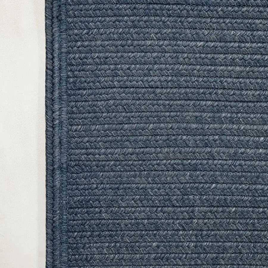 Exceptional Amini Plain rug hand-braided in India with a subtly mottled blue polypropylene, viscose, and polyester blend with hand clipping