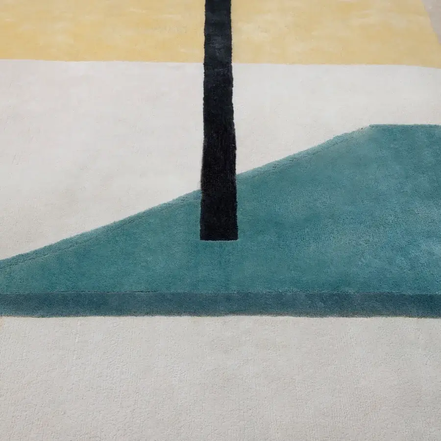 Superior Amini Nostalghia rug with geometric design in pale yellow, muted teal, and off-white organic cotton, hand-washed finish
