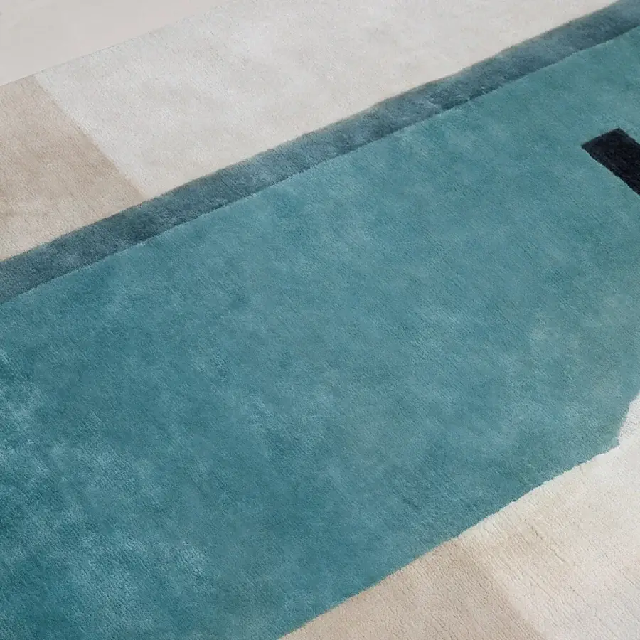 Exceptional Amini Nostalghia rug with geometric color blocking crafted in organic cotton and hand-washed carved surface