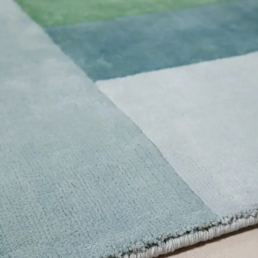 Exclusive Amini Nostalghia rug with color-blocked design hand-knotted in organic cotton with natural dyes