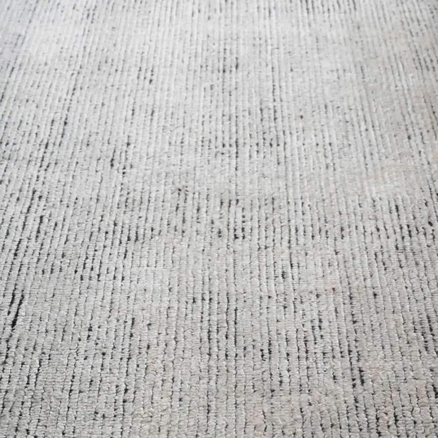 Lavish Amini Perla rug hand-knotted with pale gray bamboo silk and wool, displaying a heathered, hand-washed surface