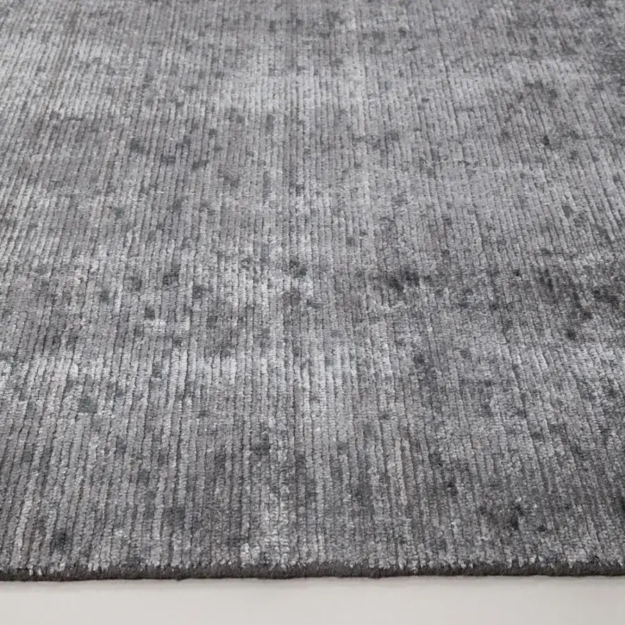 Lavish Amini Perla rug hand-knotted with bamboo silk and wool in a muted gray, finished with a gentle hand wash and clip