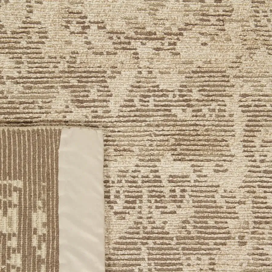 Distinguished Amini Mystique rug hand-knotted in Nepal with silk and Tibetan wool, exhibiting a neutral beige and brown textured surface