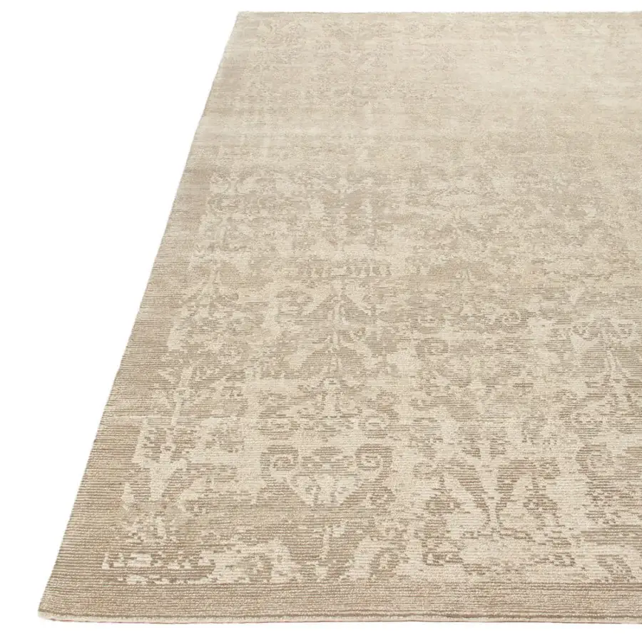 Superior Amini Mystique rug hand-knotted in Nepal with natural silk and Tibetan wool, showcasing a faded floral design and textured pile finish
