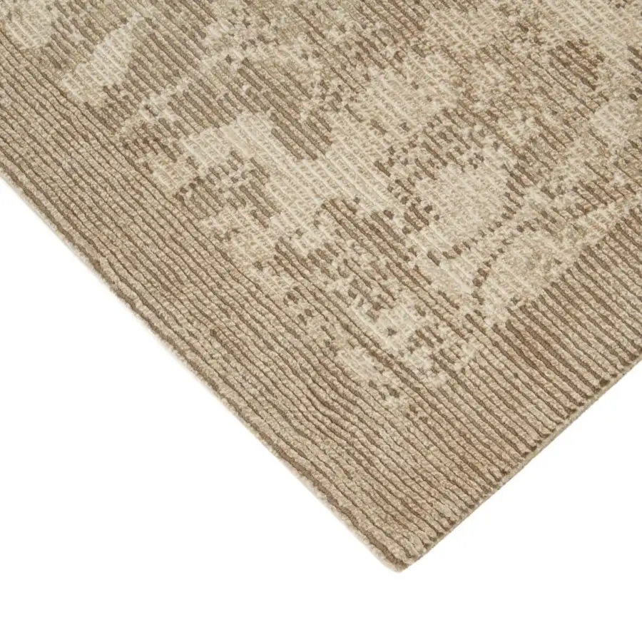 Exquisite Amini Mystique rug hand-knotted in Nepal with silk and Tibetan wool exhibiting a complex floral pattern and textured pile finish