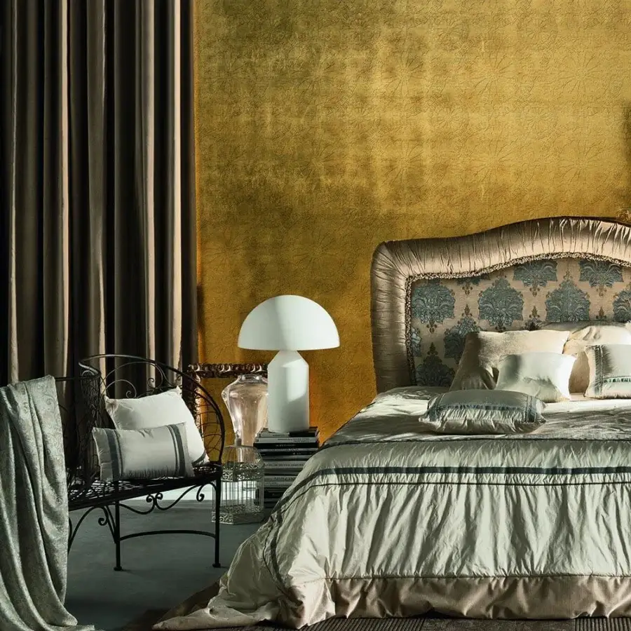 Elegant Adriani e Rossi Bohemian wallpaper in radiant gold with woven circular motifs and graceful gradient finish