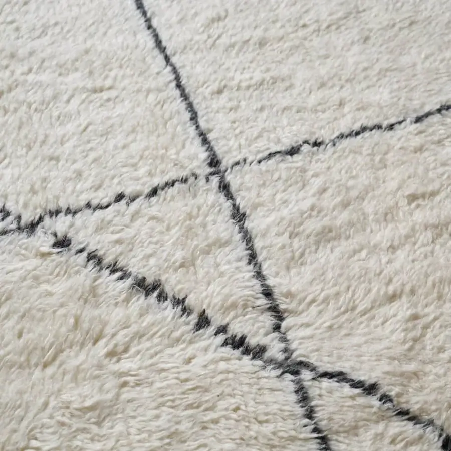 Exceptional Amini Nomadic rug hand-knotted in India with ivory and black wool mohair blend and hand-washed carved texture