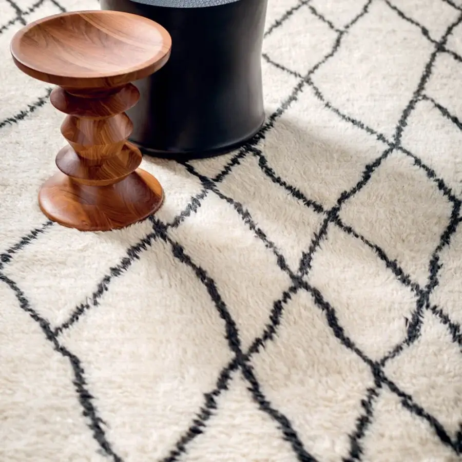 Distinguished Amini Nomadic rug hand-knotted in India with ivory and black wool and mohair exhibiting a hand-washed carved finish