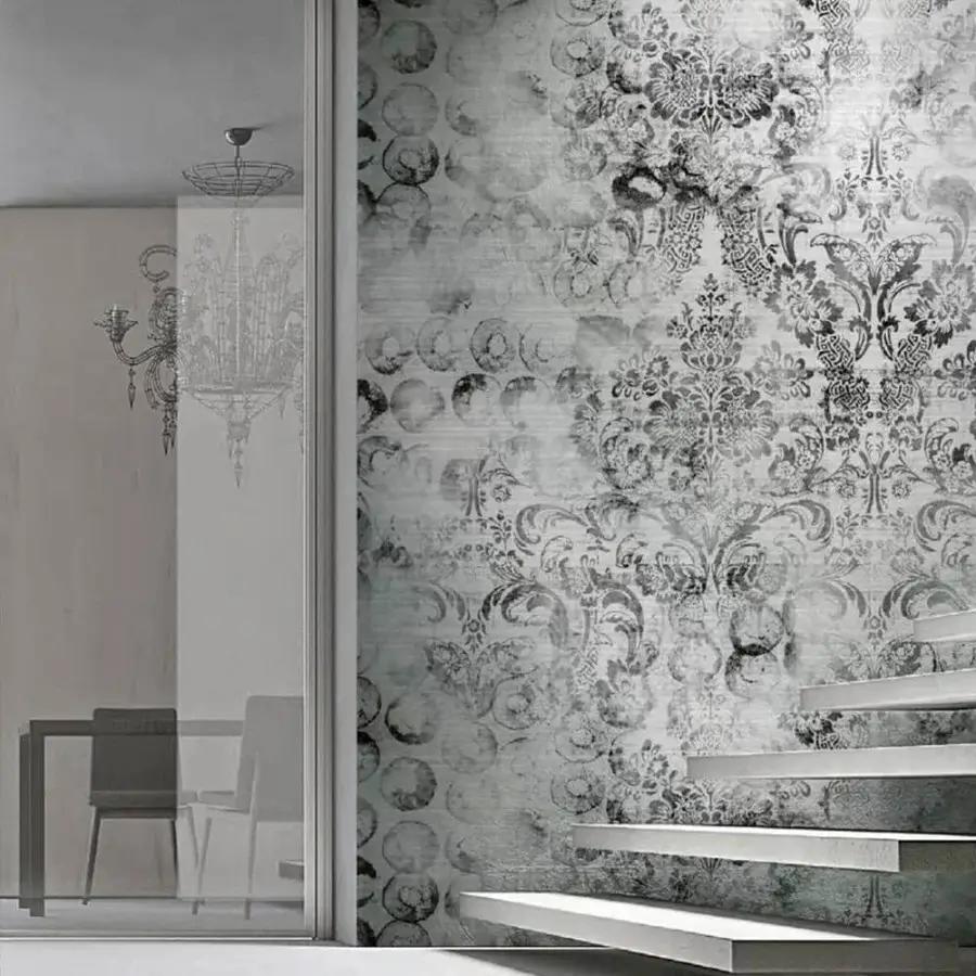Distinguished Adriani e Rossi Victory wallpaper showcases baroque-inspired swirling floral, geometric patterns with a subtly distressed gray surface