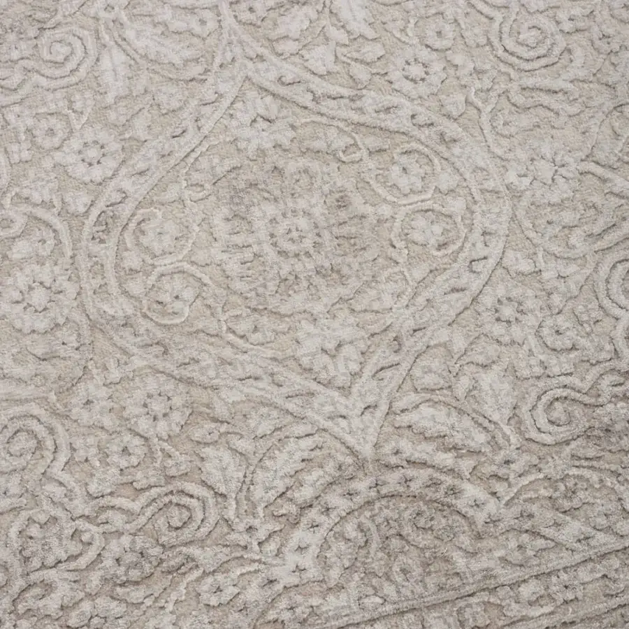 Distinguished Amini Bellagio rug showcasing organic floral motifs in alabaster and beige green with a hand-knotted wool viscose pile