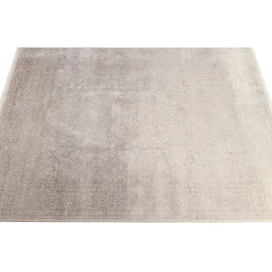 Distinguished Amini Bellagio rug exhibiting curvilinear patterns in beige and gray wool viscose with a hand-knotted finish