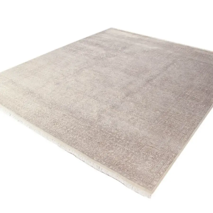 Elegant Amini Bellagio rug exhibiting floral motifs in grayish-beige wool and viscose with a hand-washed textured pile