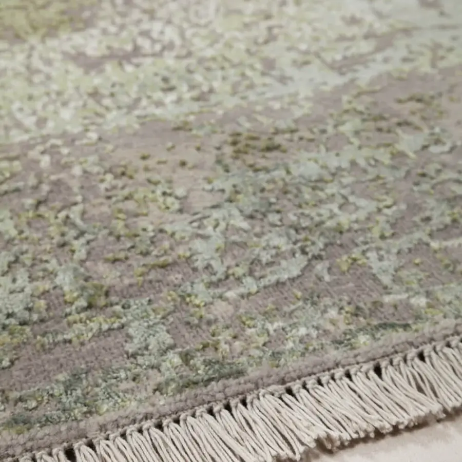 Lavish Amini Bellagio rug hand-knotted in India with wool and viscose displaying a faded floral pattern and textured pile finish