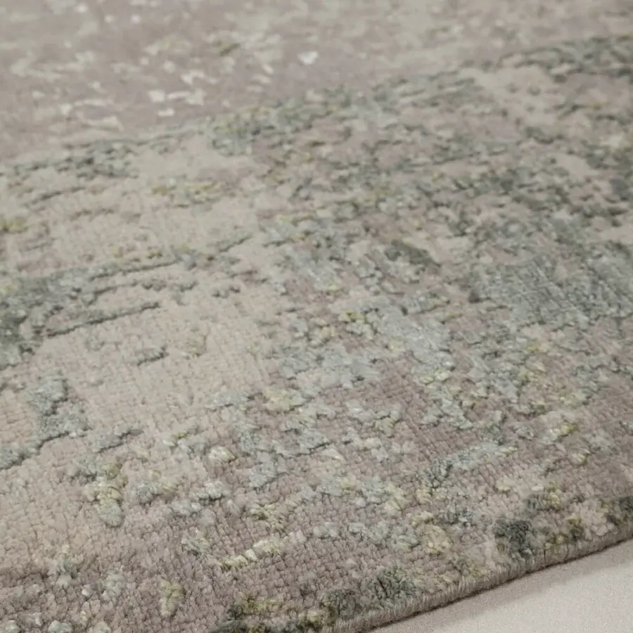 Refined Amini Bellagio rug hand-knotted with seventy percent wool and thirty percent viscose displaying a subtle distressed pattern in mauve and gray tones