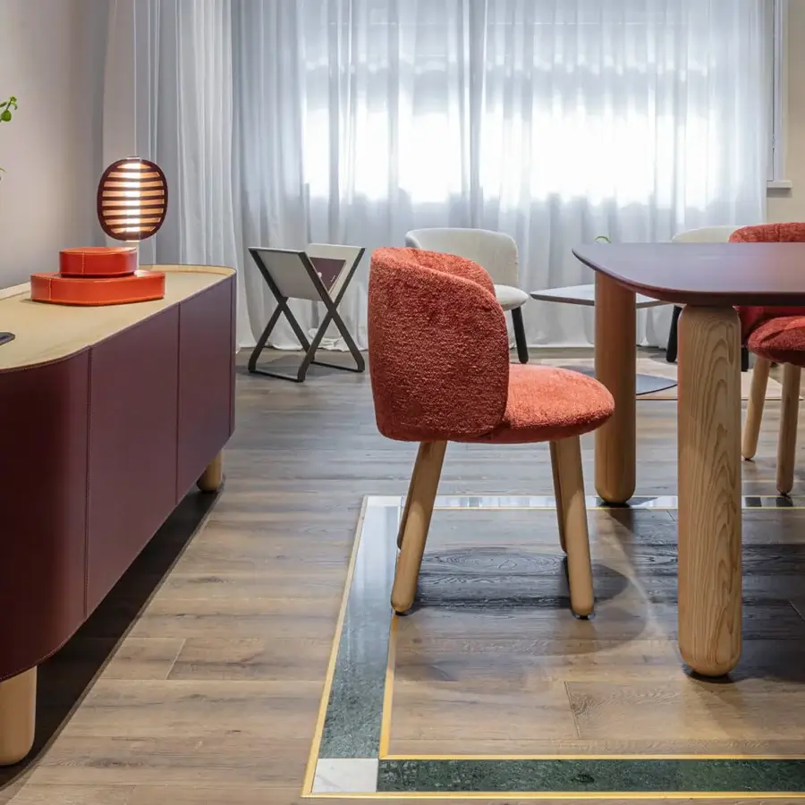 Exceptional Enrico Pellizzoni Isabel chair with reddish-orange textured fabric upholstery and satin finished natural ash wood legs