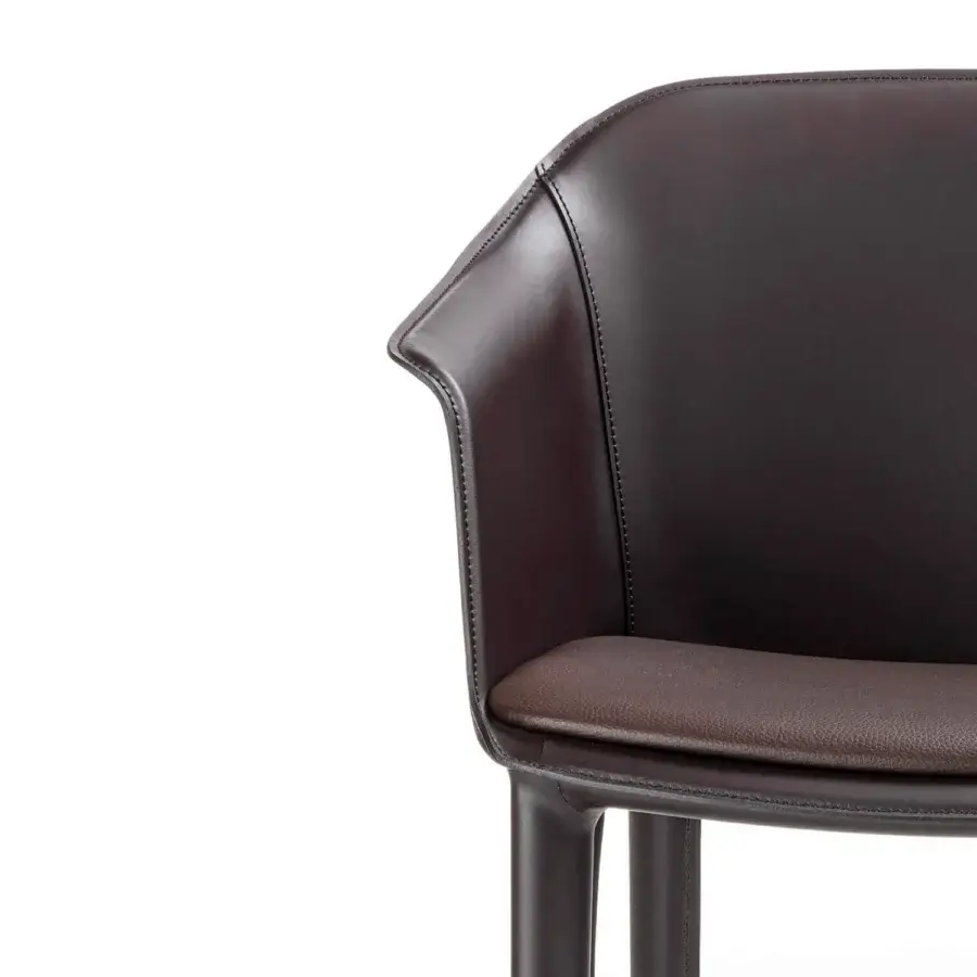 Superior Enrico Pellizzoni Eva armchair with curved silhouette and dark brown leather upholstery crafted with satin finish