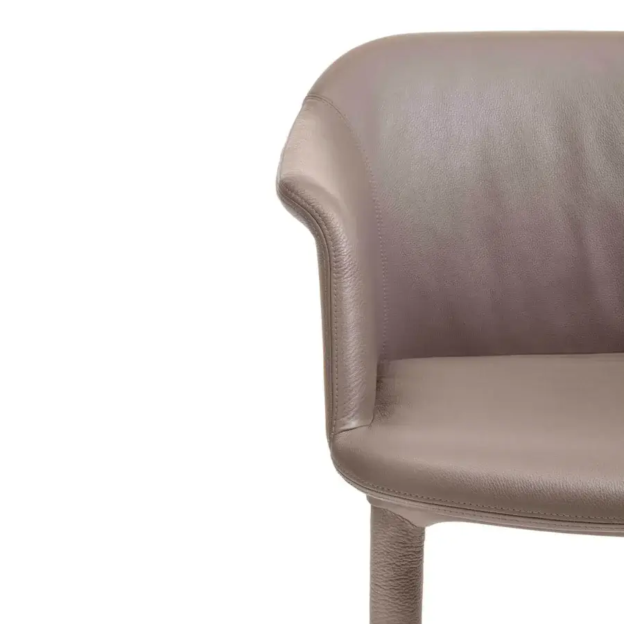 Distinguished Enrico Pellizzoni Eva armchair with sculpted form and smooth textured leather in a warm gray-brown tone