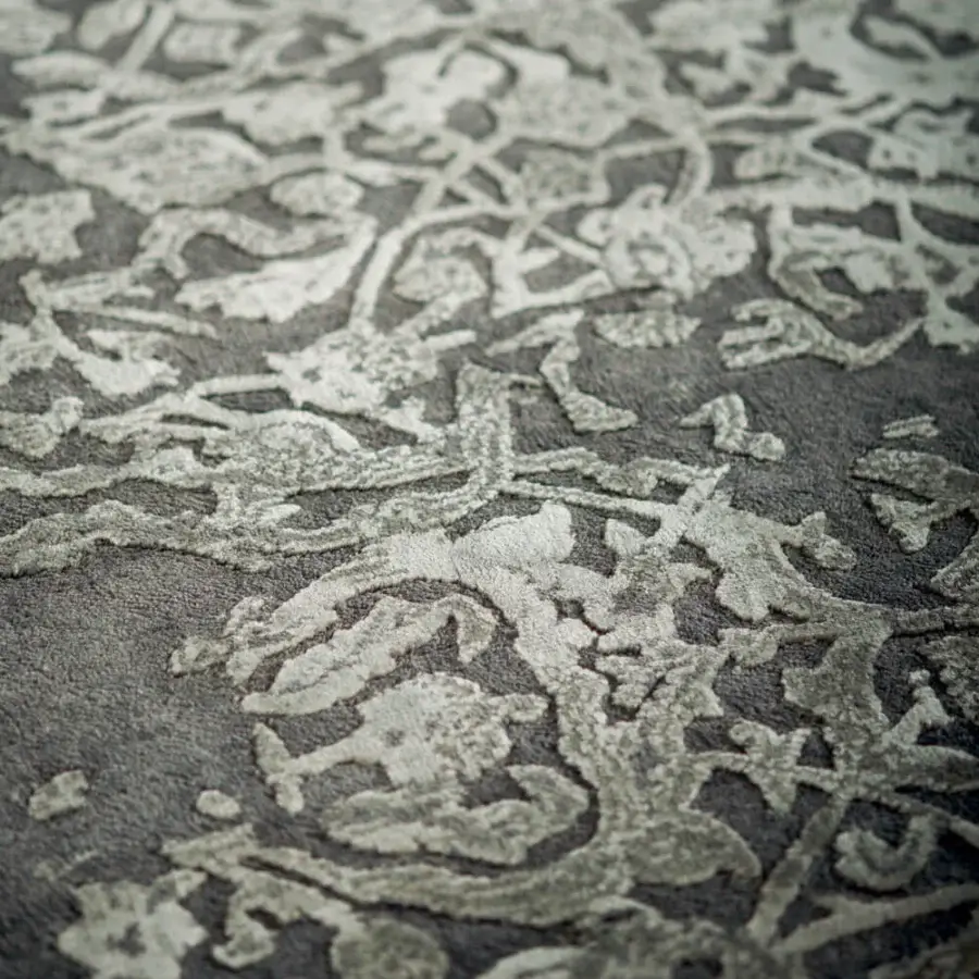 Exceptional Amini Bellagio III rug showcasing swirling floral design in muted grey with wool and viscose construction and carved pile