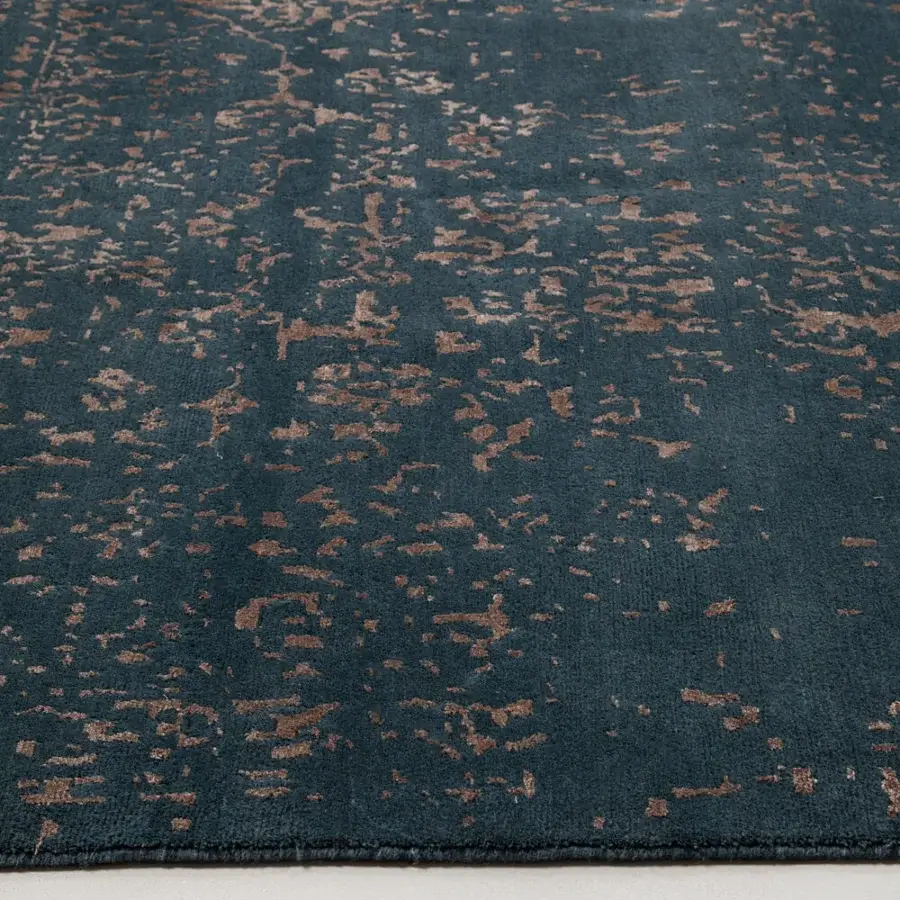 Superior Amini Artemisia rug with subtly distressed abstract pattern in deep teal and bronze-toned wool viscose pile crafted with hand-washed finish