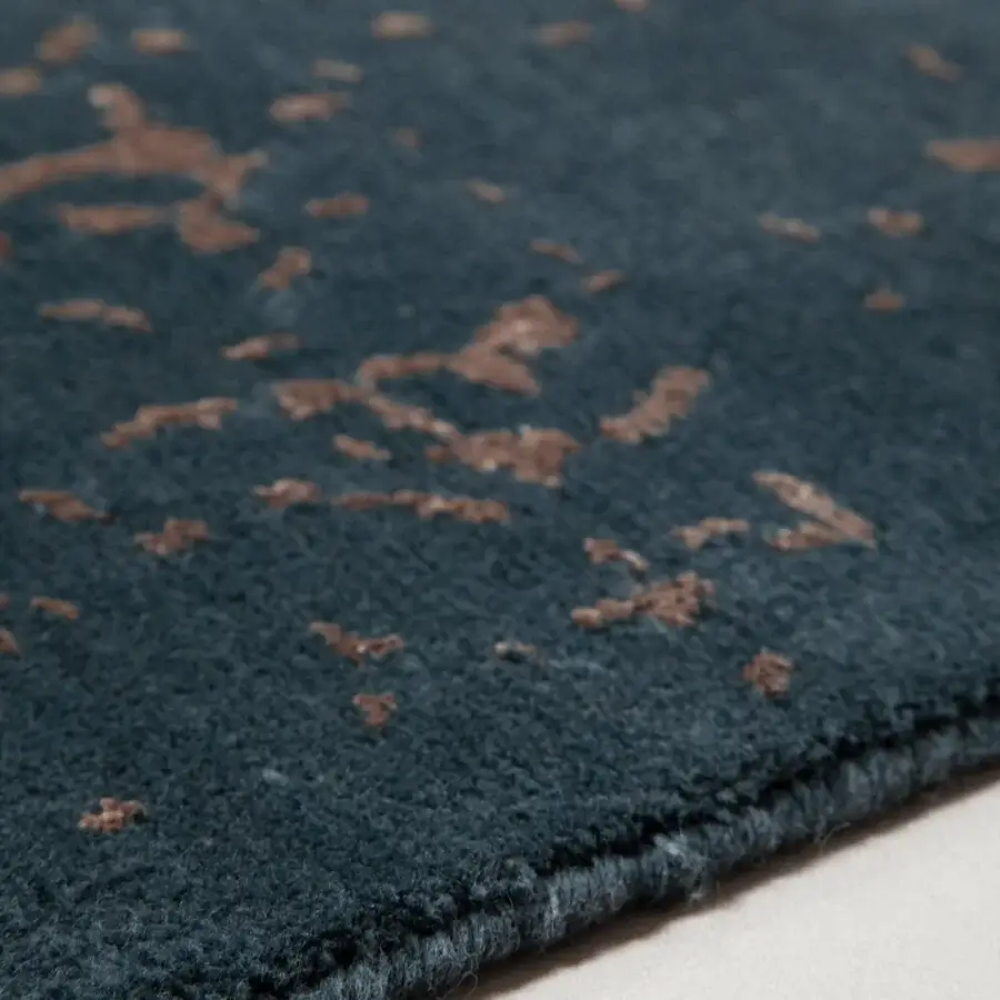 Distinguished Amini Artemisia rug with abstract pattern in deep teal and earthy terracotta tones, hand-knotted in wool and viscose with carved finish