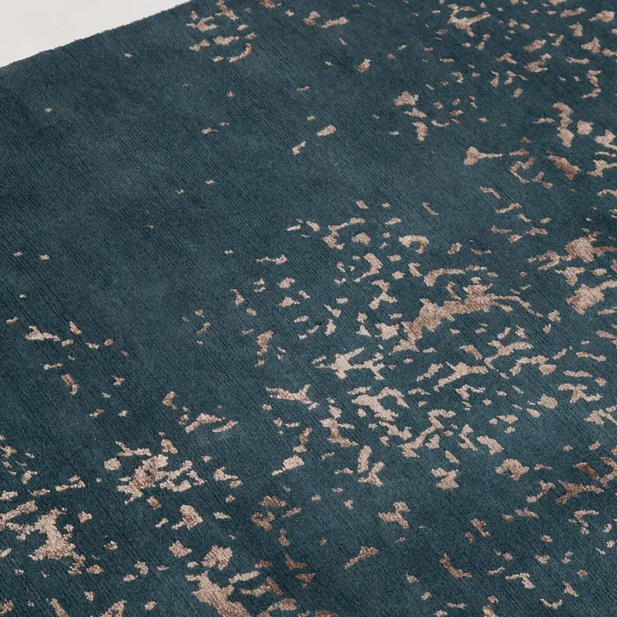 Lavish Amini Artemisia rug with abstract pattern in deep teal accented with muted gold, hand-knotted wool and viscose pile