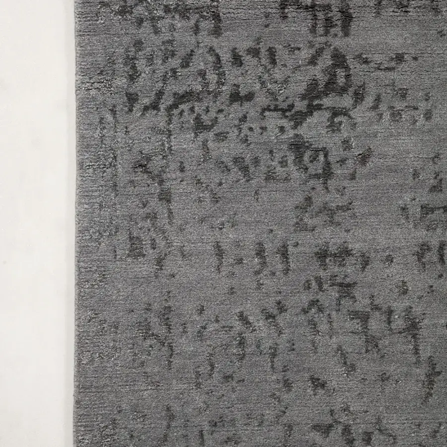 Lavish Amini Artemisia rug hand-knotted in India with wool and viscose displaying a subtly distressed abstract pattern and skilled finish