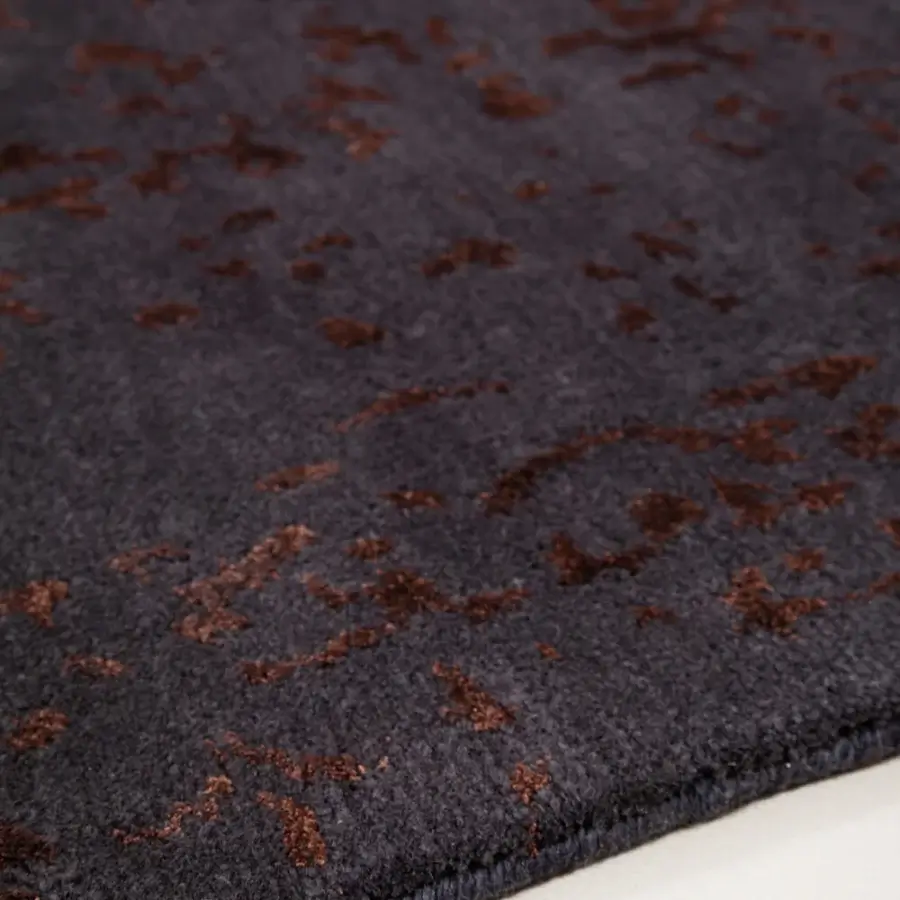 Lavish Amini Artemisia rug hand-knotted in India with wool and viscose displaying mottled charcoal gray and brownish-orange tones with a carved finish